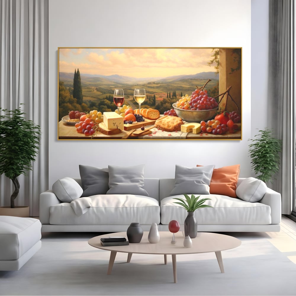 Tablou canvas cu tablou canvas cu peisaj tomnatic si masa imbelsugata, in rama de aluminiu auriu, pe perete intr-un living